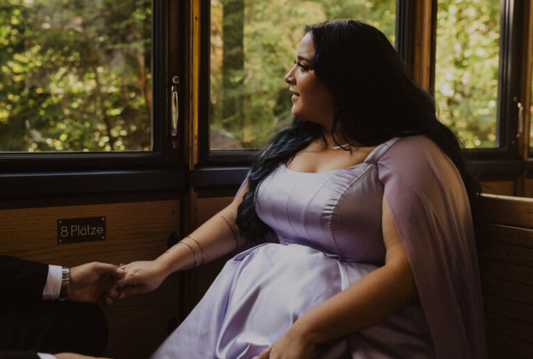 Bride with a purple dress in the train to Schynige Platte in Switzerland.