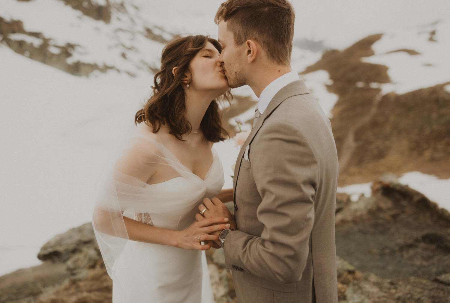 Zermatt Switzerland Elopement at Riffelsee Couple is kissing at their Elopement in Zermatt