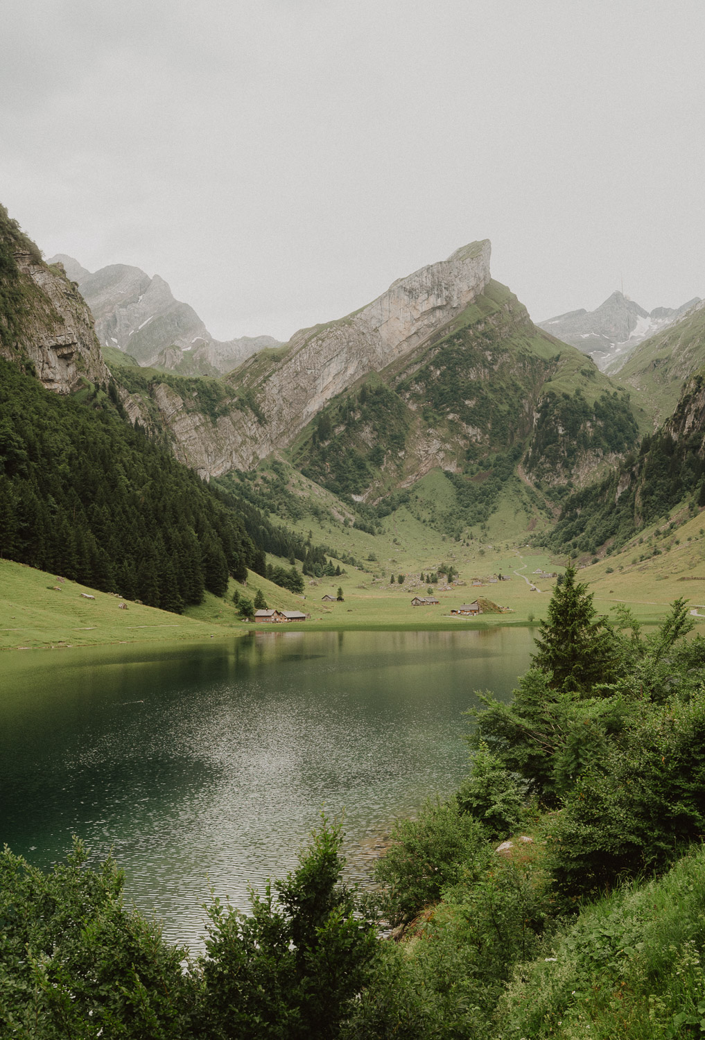 Looking at Seealpsee in Appenzell, photographed by an elopement and proposal photographer.