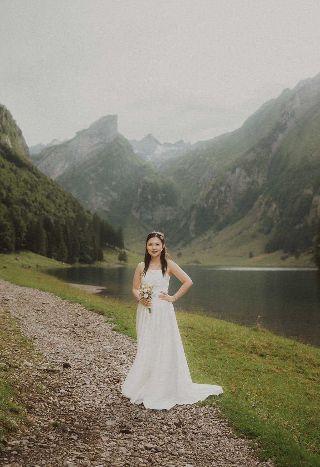 Bride eloping at Seealpsee in Appenzell, photographed by an elopement and proposal photographer.