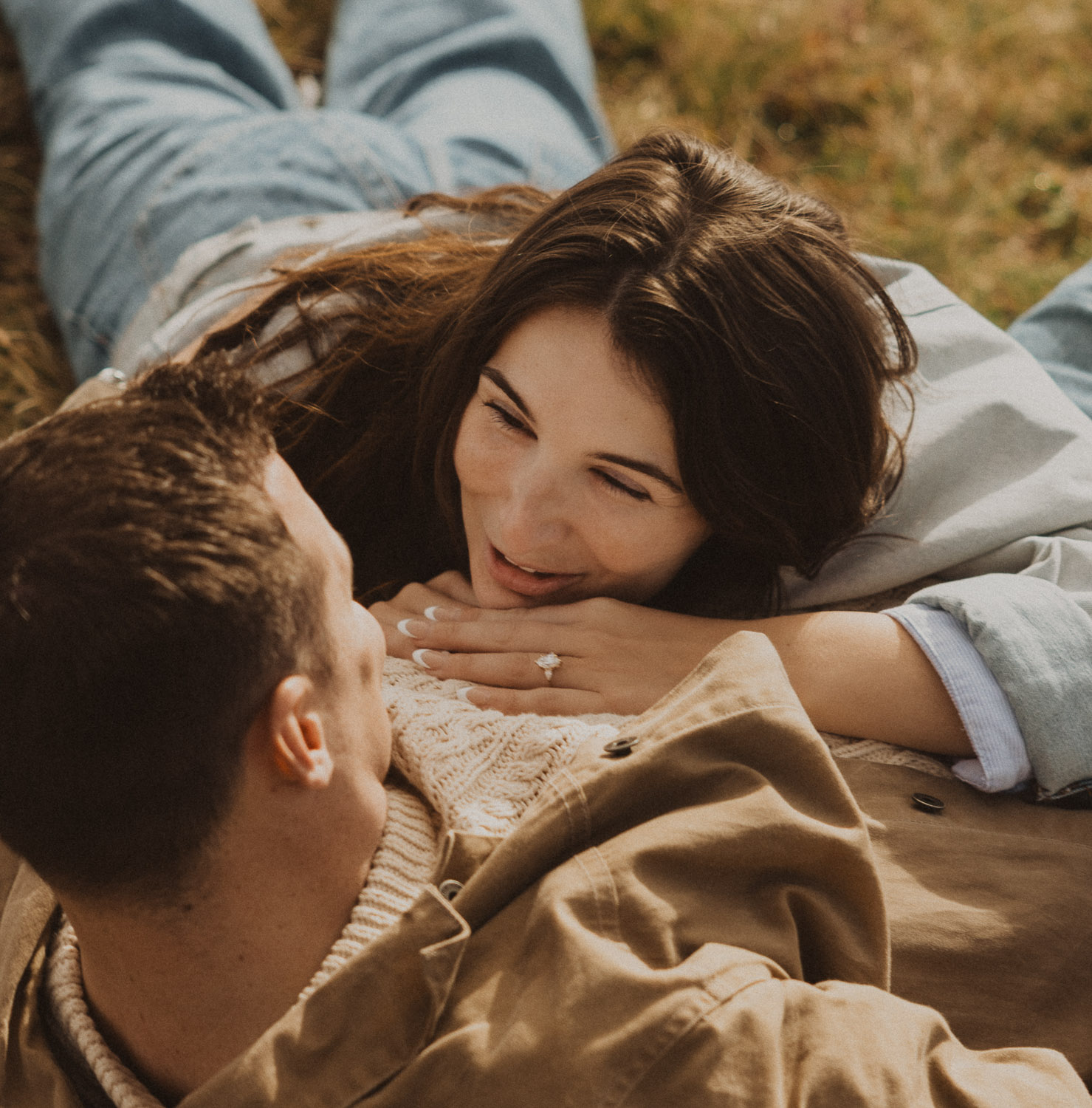 Couple at a surprise proposal photography session in the Jungfrauregion with alpine mountain scenery and natural outdoor setting in daylight.